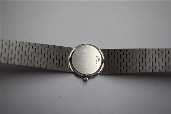 A ladys 18ct white gold Piaget manual wind wrist watch with diamond and emerald set bezel and jade dial,